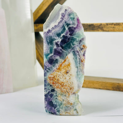fluorite cut base with decorations in the background