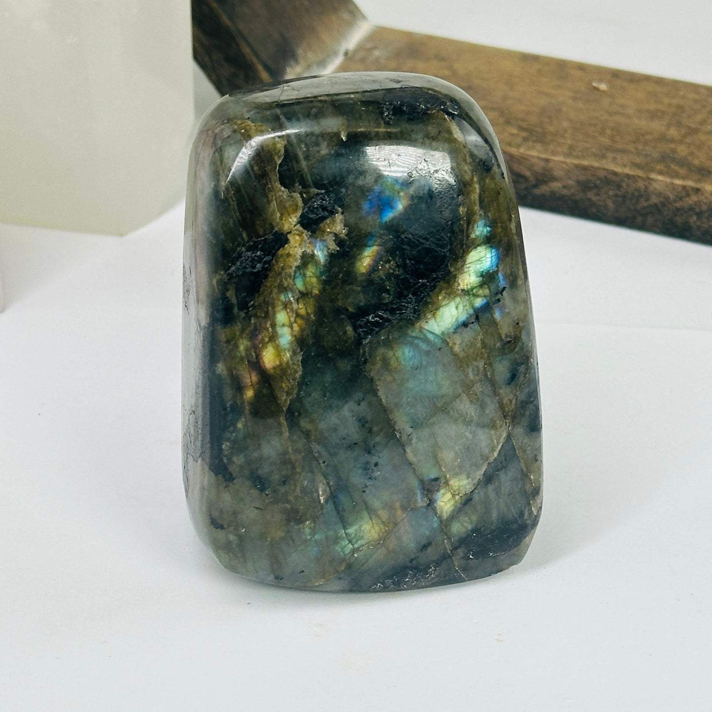 labradorite with decorations in the background