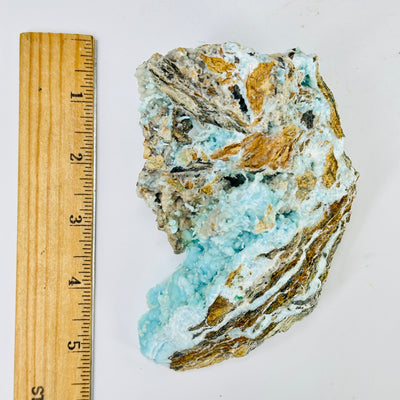 blue aragonite with decorations in the background