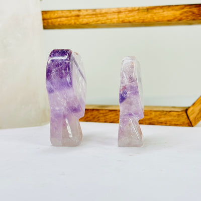 amethyst cut base with decorations in the background