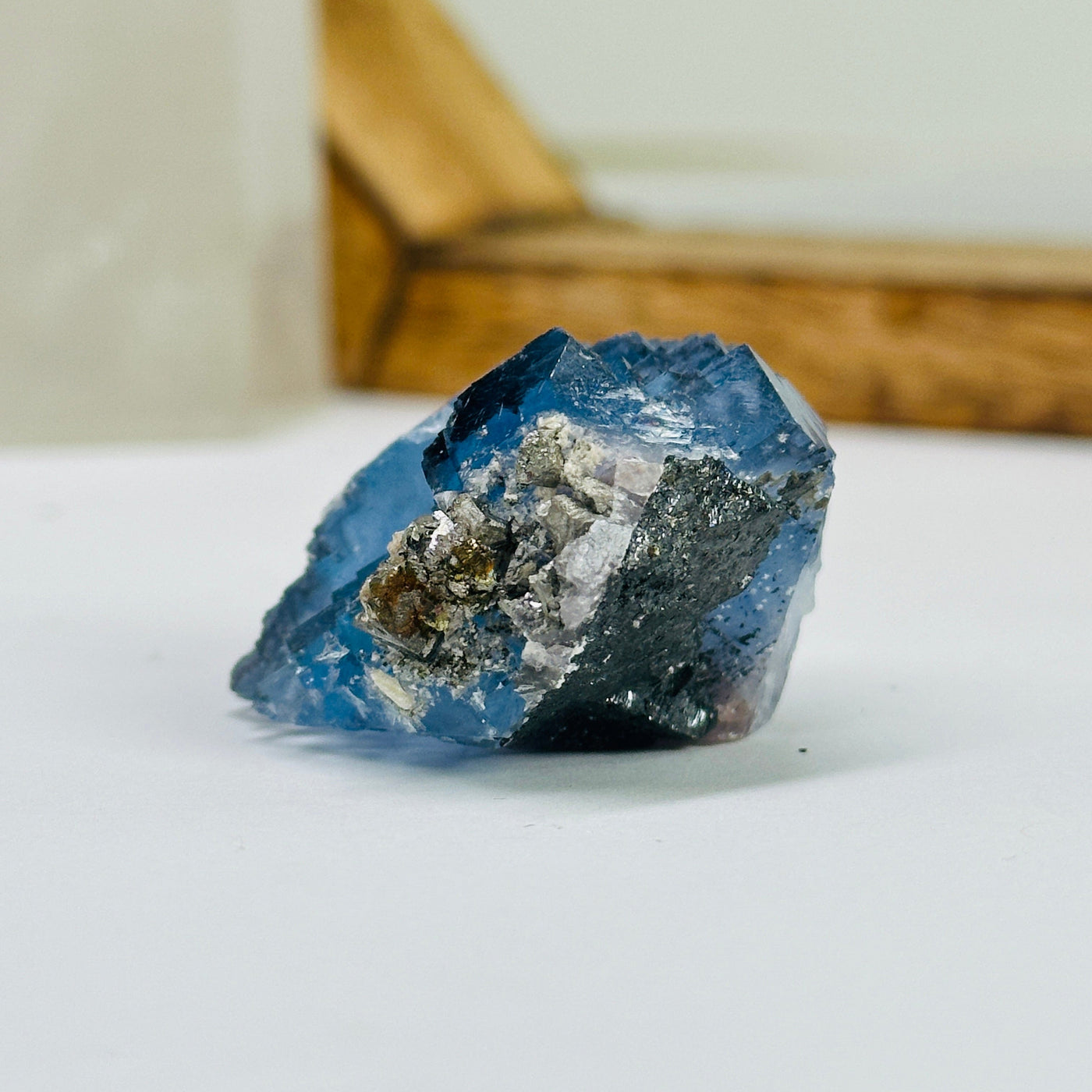 blue fluorite with decorations in the background