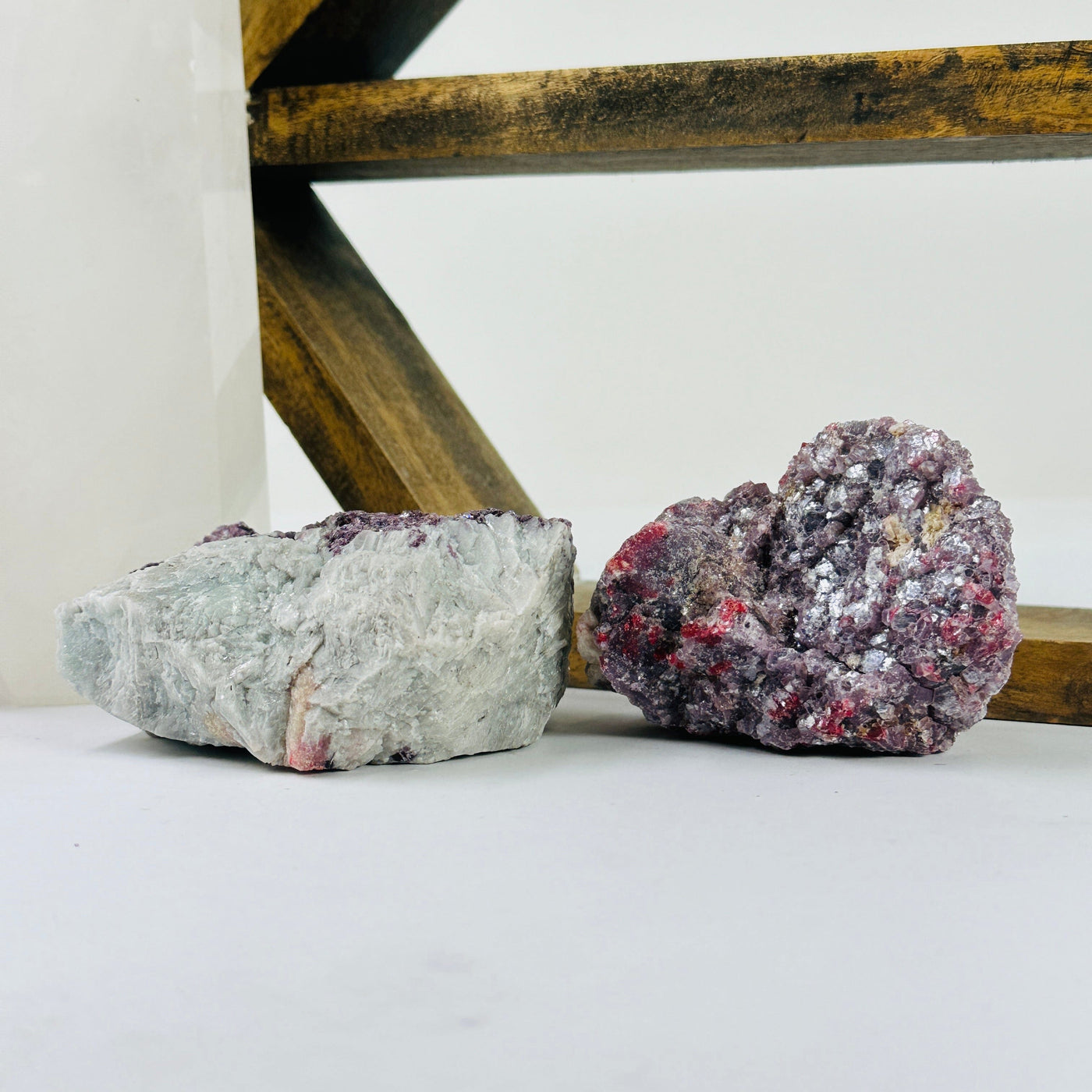 lepidolite cluster with decorations in the background