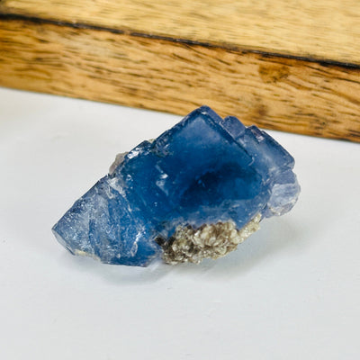 blue fluorite with decorations in the background