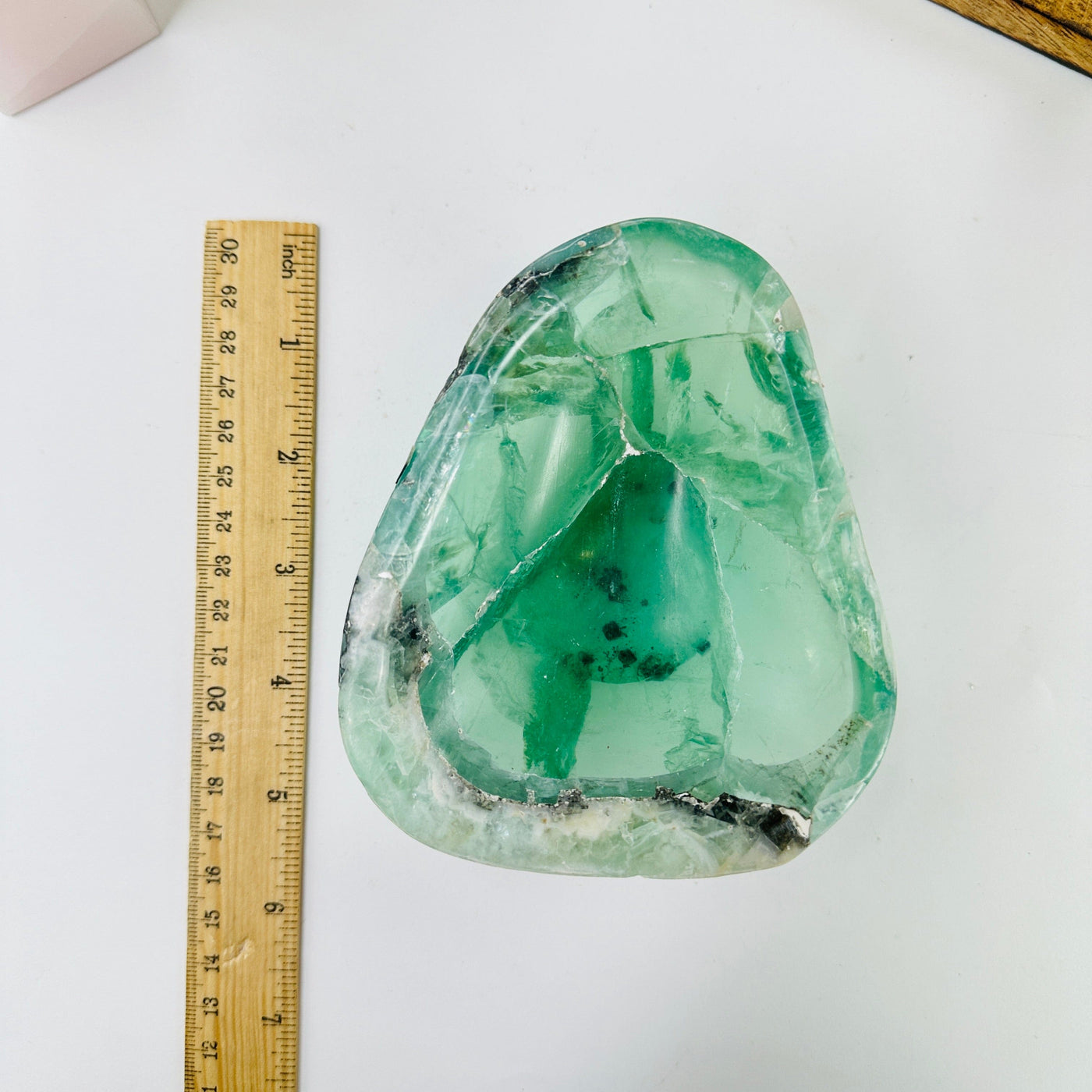 fluorite bowl next to a ruler for size reference