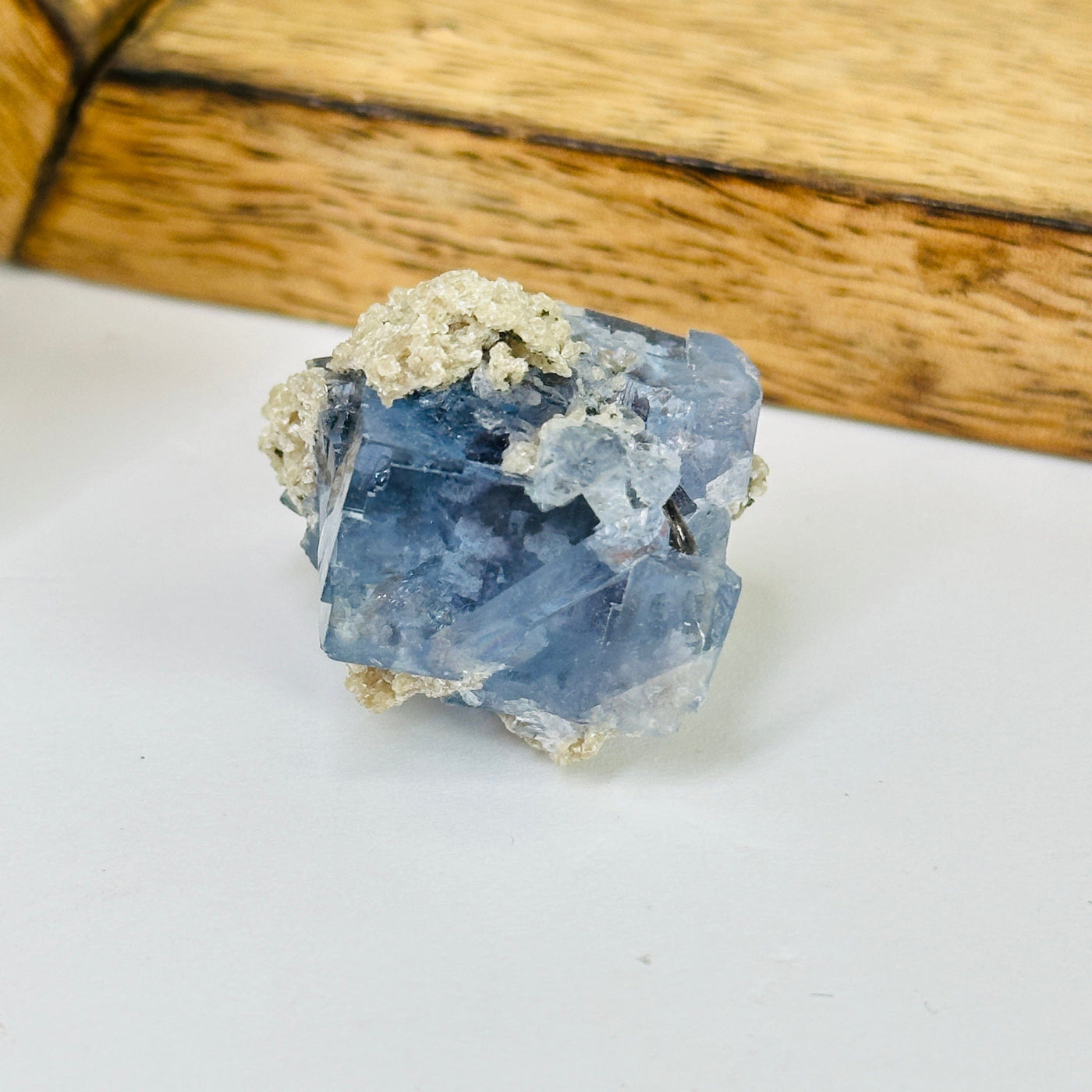 blue fluorite with decorations in the background