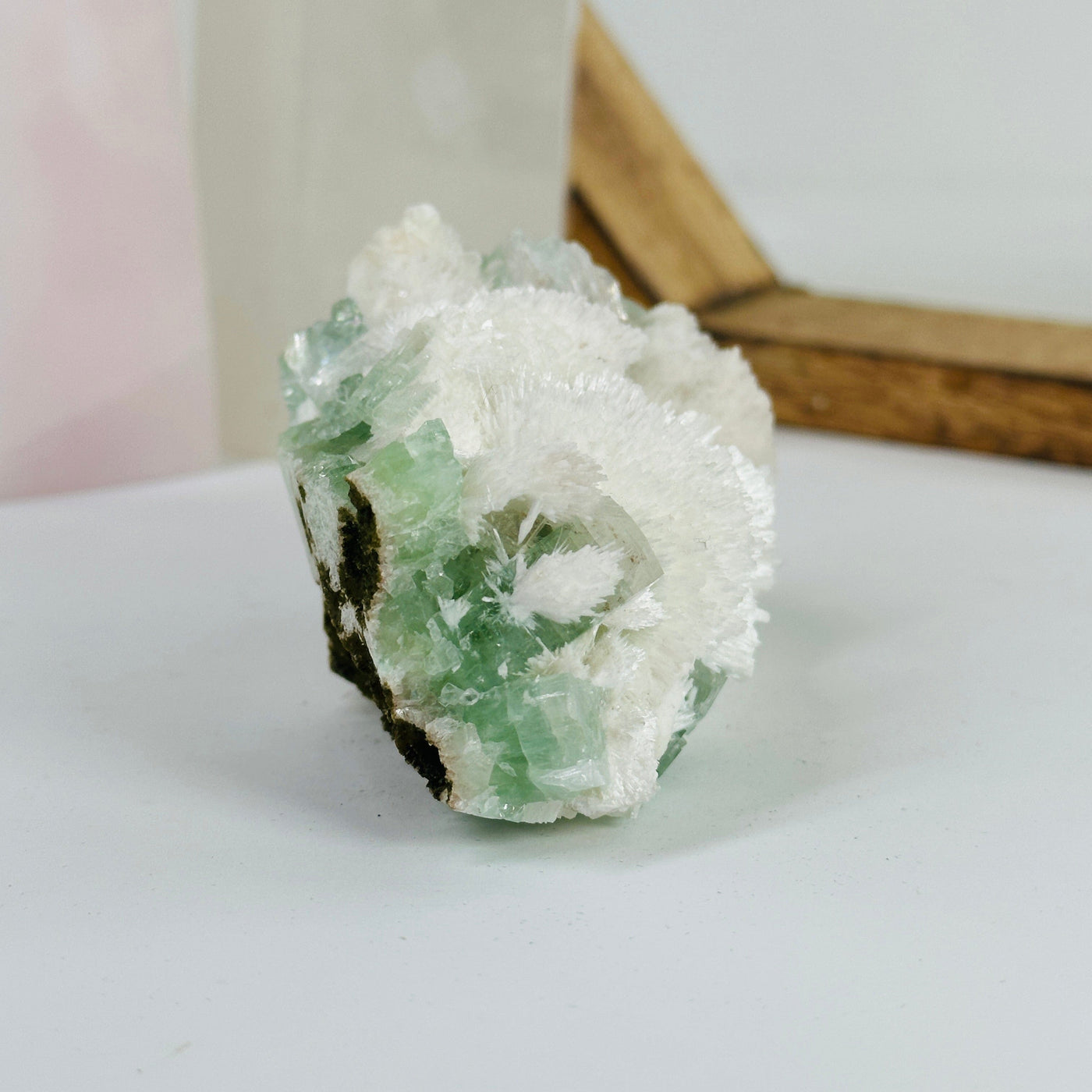 apophyllite with decorations in the background