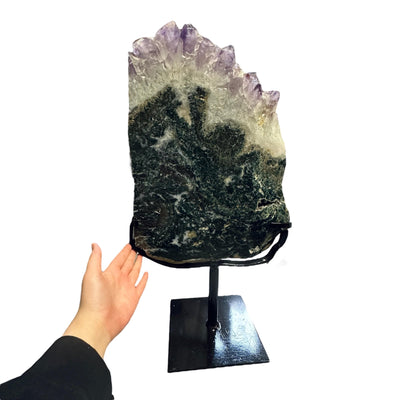 amethyst with jasper on metal stand on white background