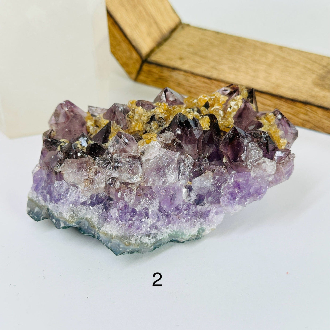 AMETHYST CLUSTER with decorations in the background