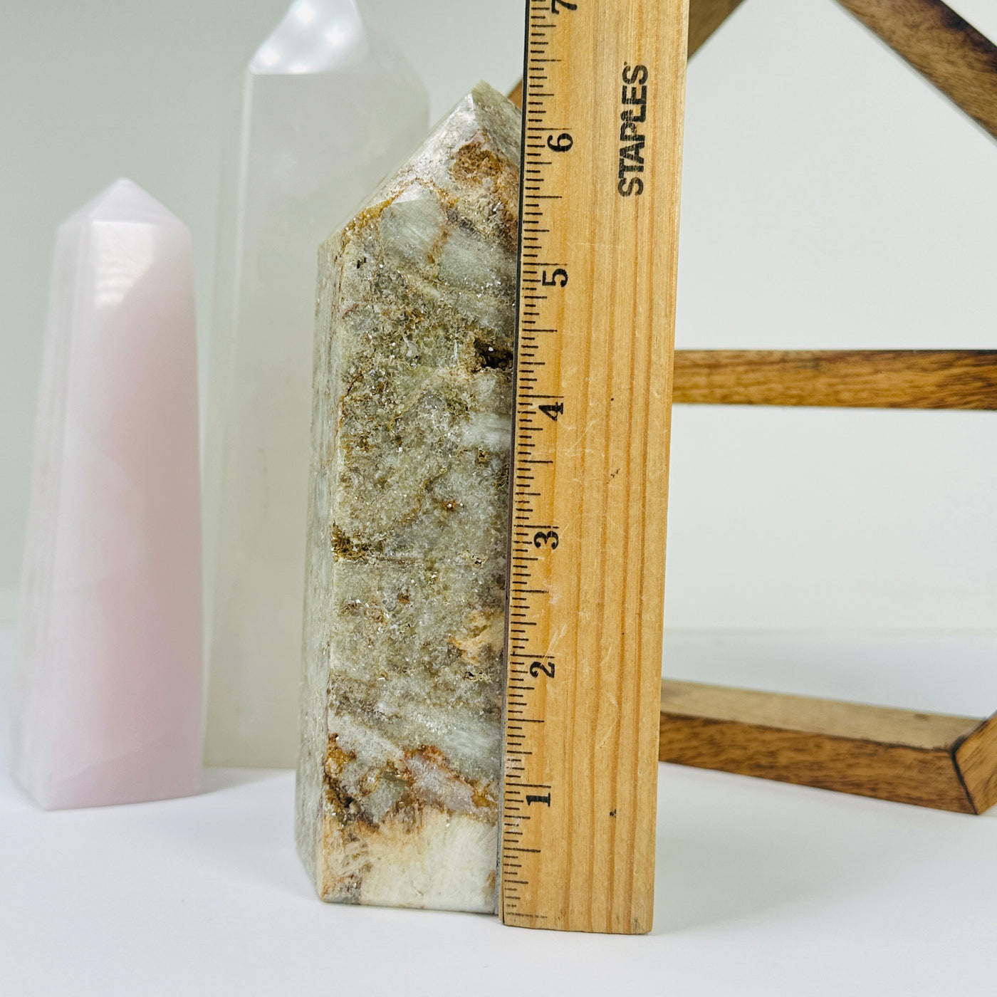 tourmaline point next to a ruler for size reference