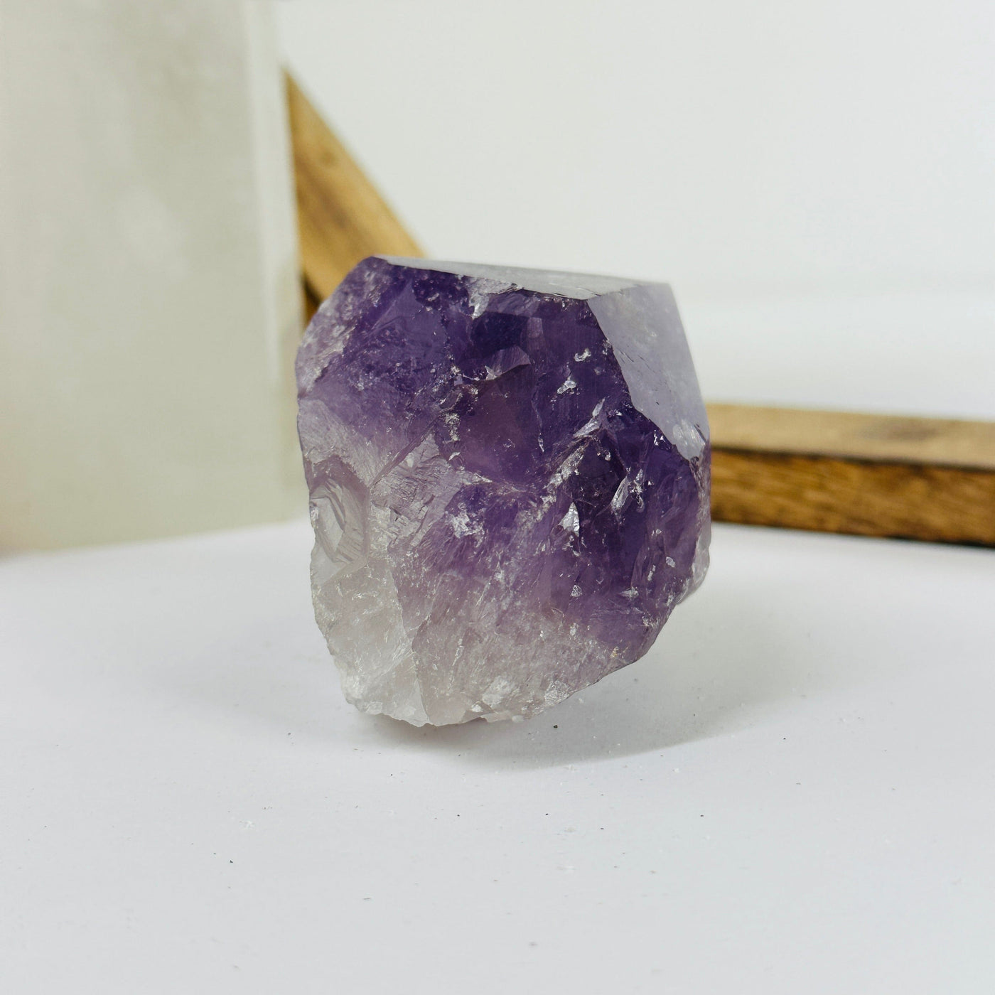 amethyst point with decorations in the background