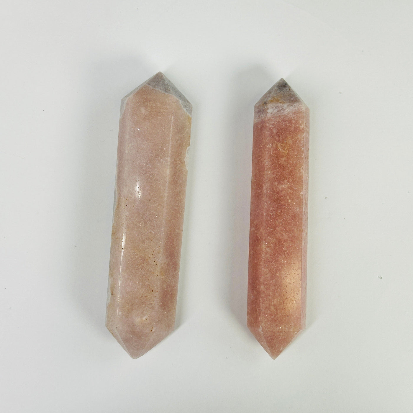 pink amethyst points with decorations in the background