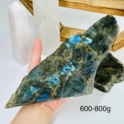 labradorite slab with decorations in the background