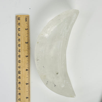 crystal quartz moon bowl next to a ruler for size reference