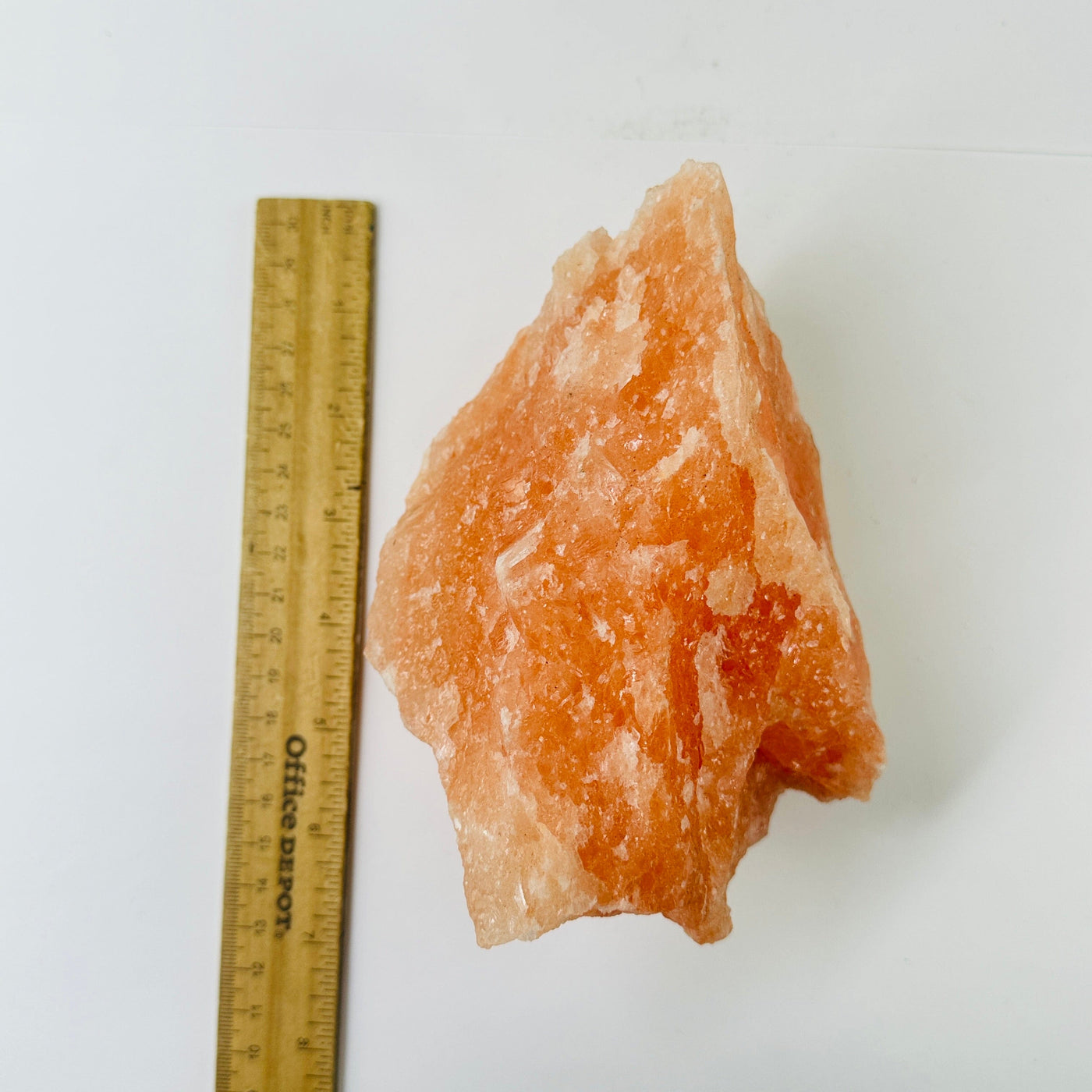 Himalayan salt cluster next to a ruler for size reference