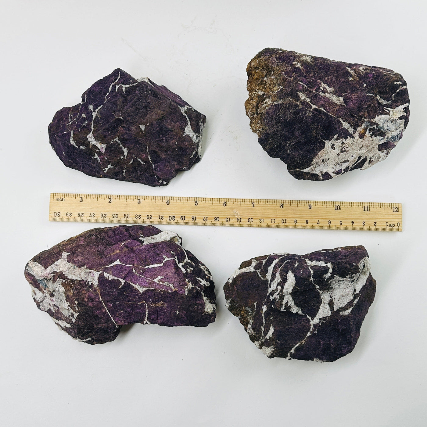 purpurite next to a ruler for size reference