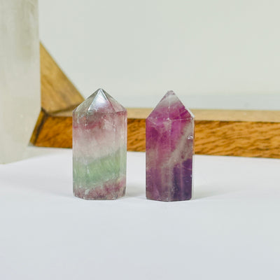 fluorite points with decorations in the background