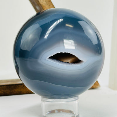 agate sphere with decorations in the background