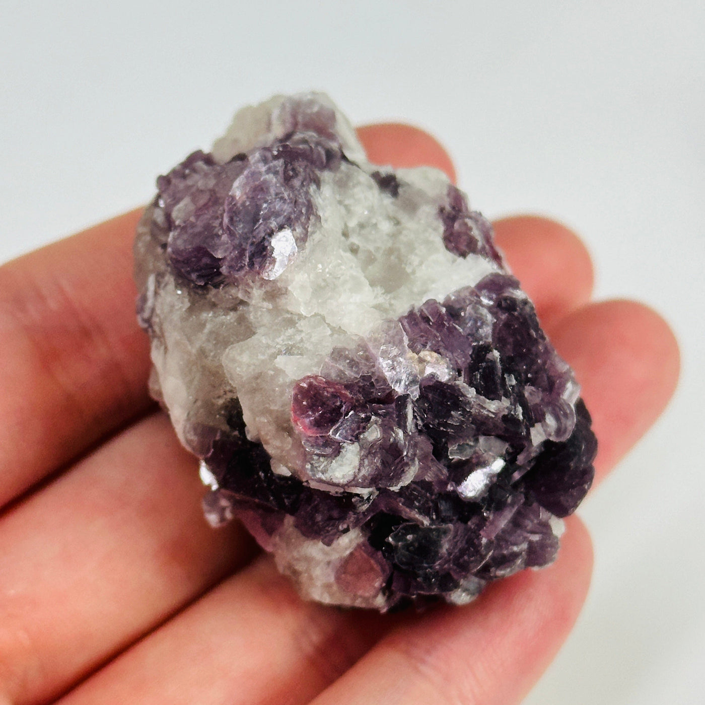 watermelon tourmaline with decorations in the background