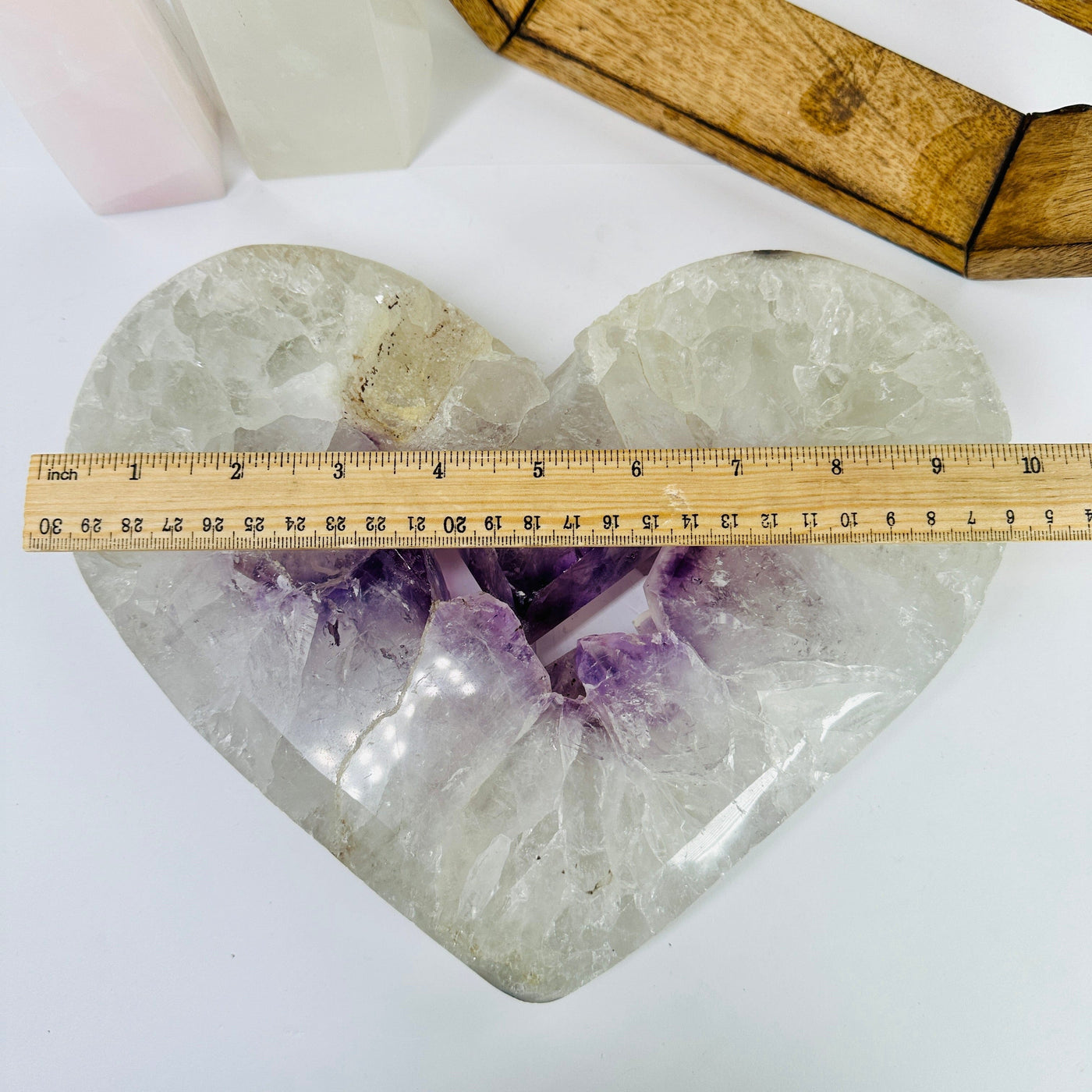 amethyst heart next to a ruler for size reference