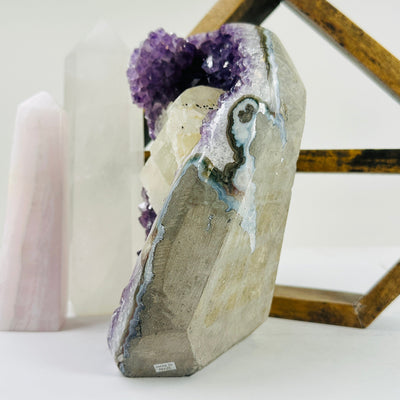 amethyst cut base with decorations in the background