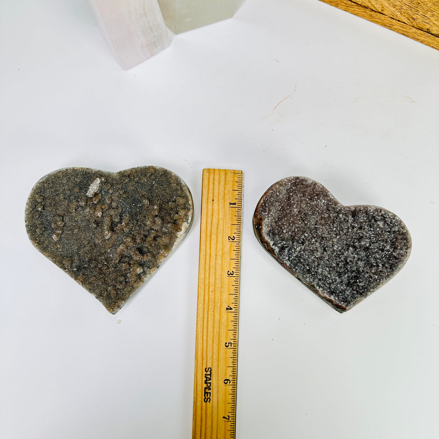 amethyst heart with decorations in the background