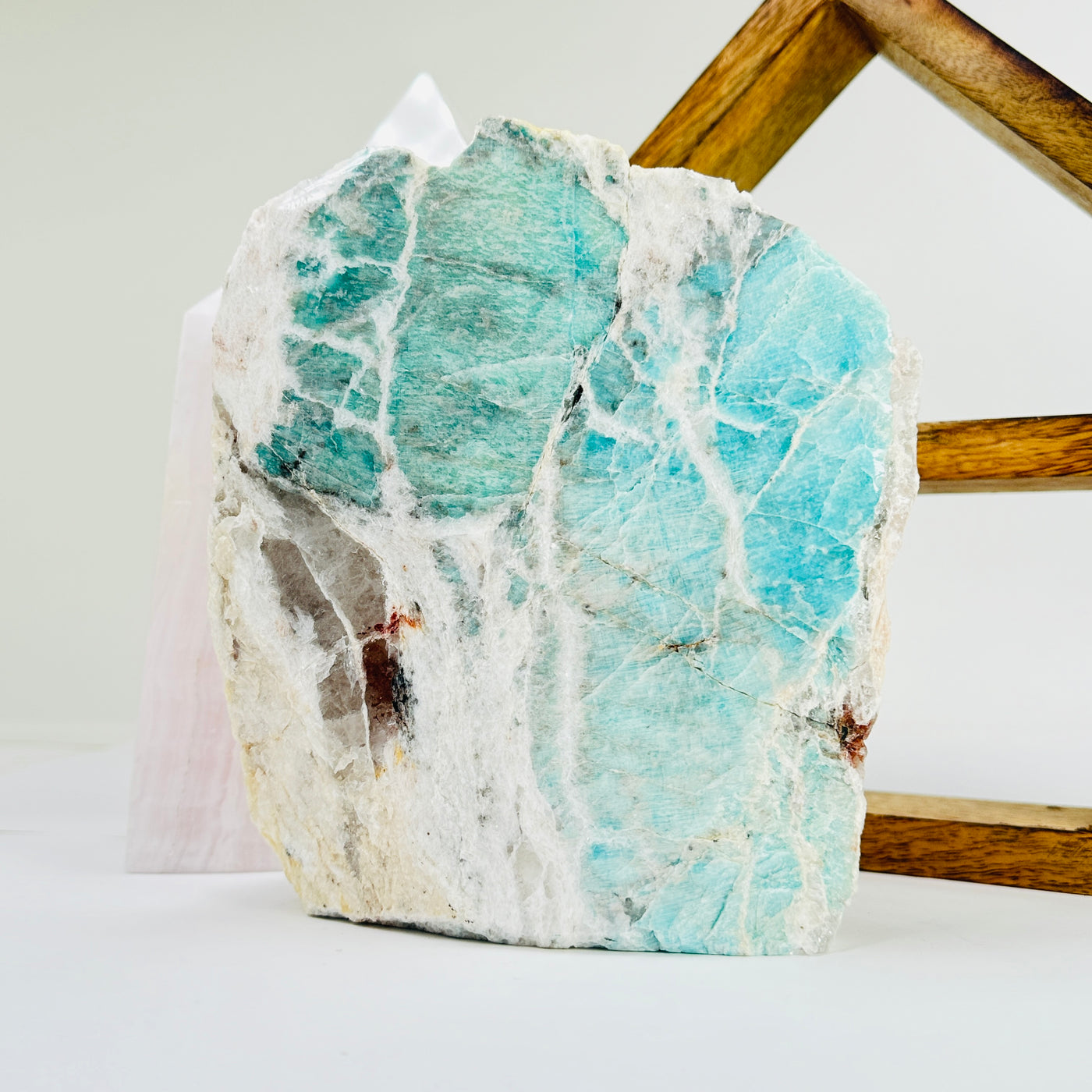 amazonite cut base with decorations in the background