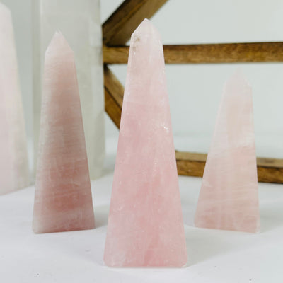 rose quartz polished tower with decorations in the background