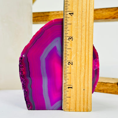 agate candle holder next to a ruler for size reference