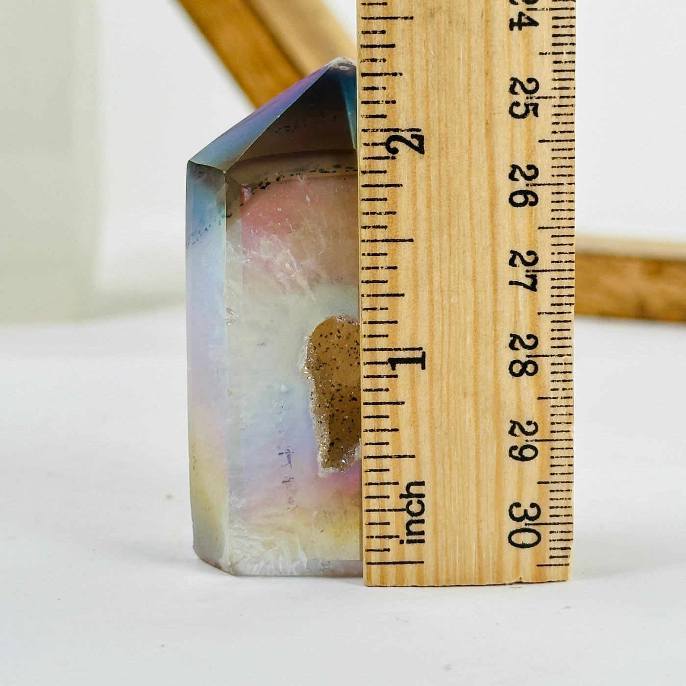 angel aura agate point next to a ruler for size reference