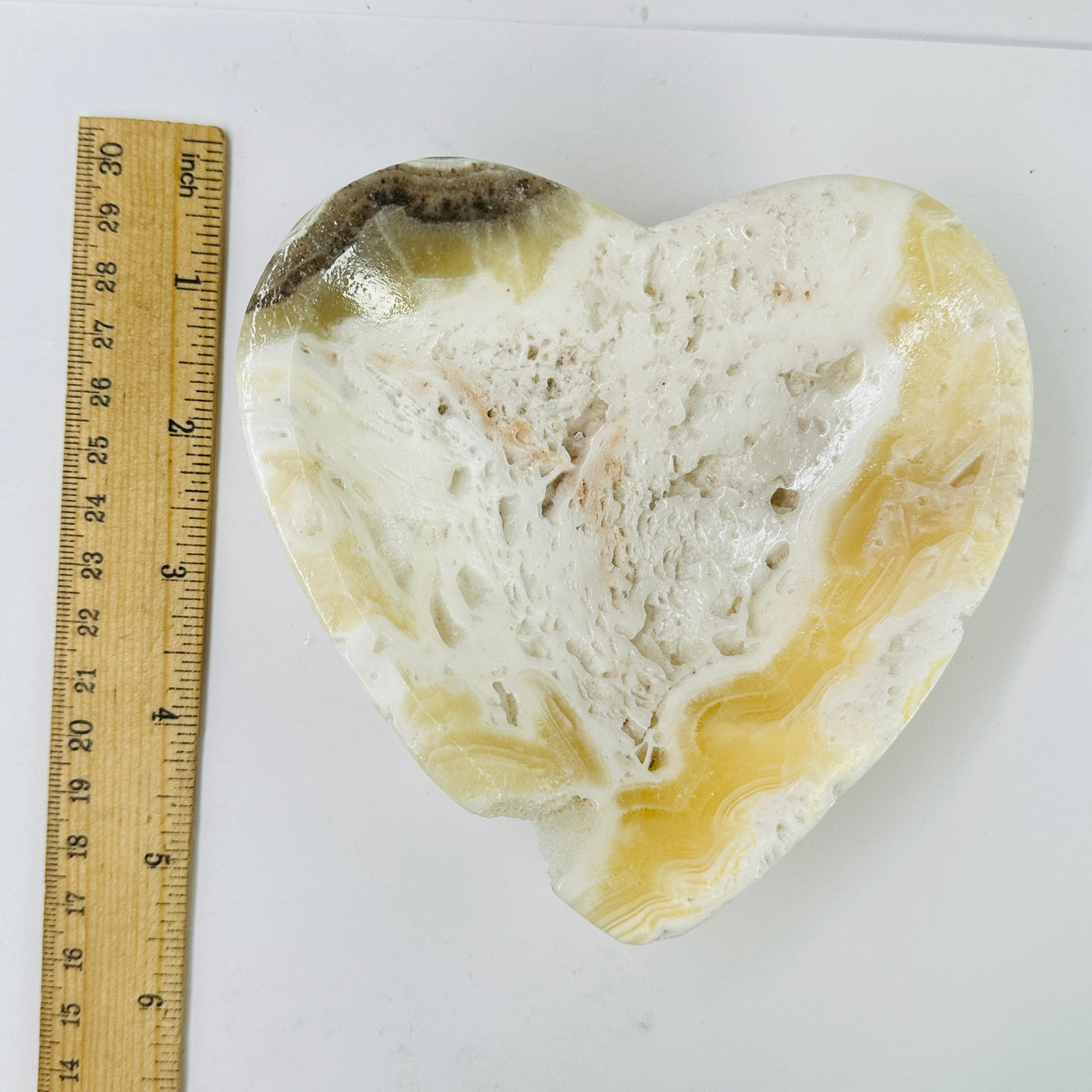 Mexican onyx bowl next to a ruler for size reference