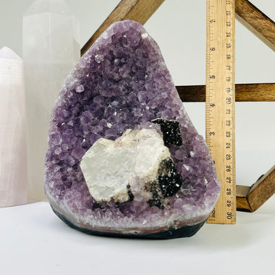 amethyst cut base with decorations in the background