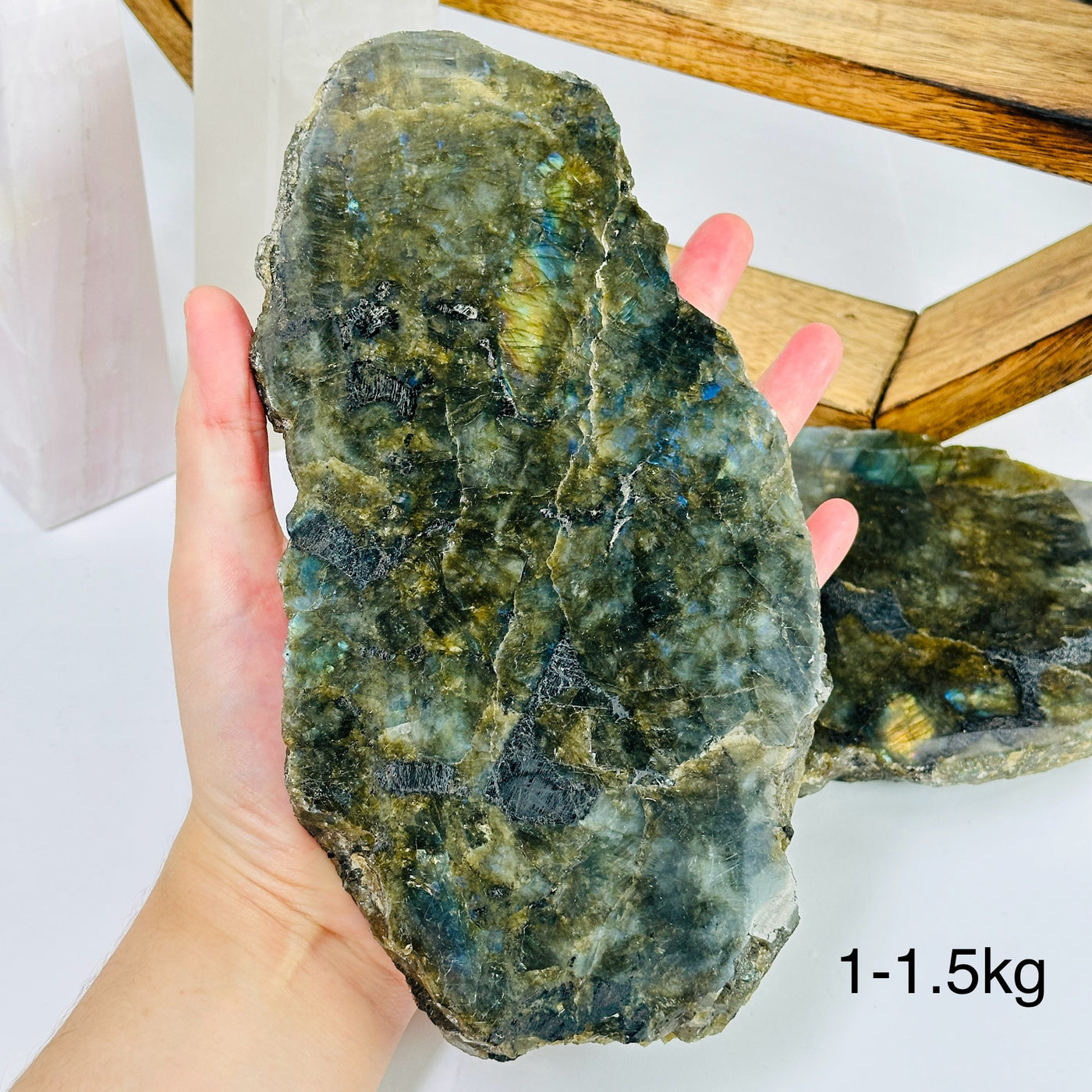 labradorite slab with decorations in the background