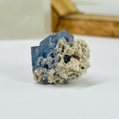 blue fluorite with decorations in the background