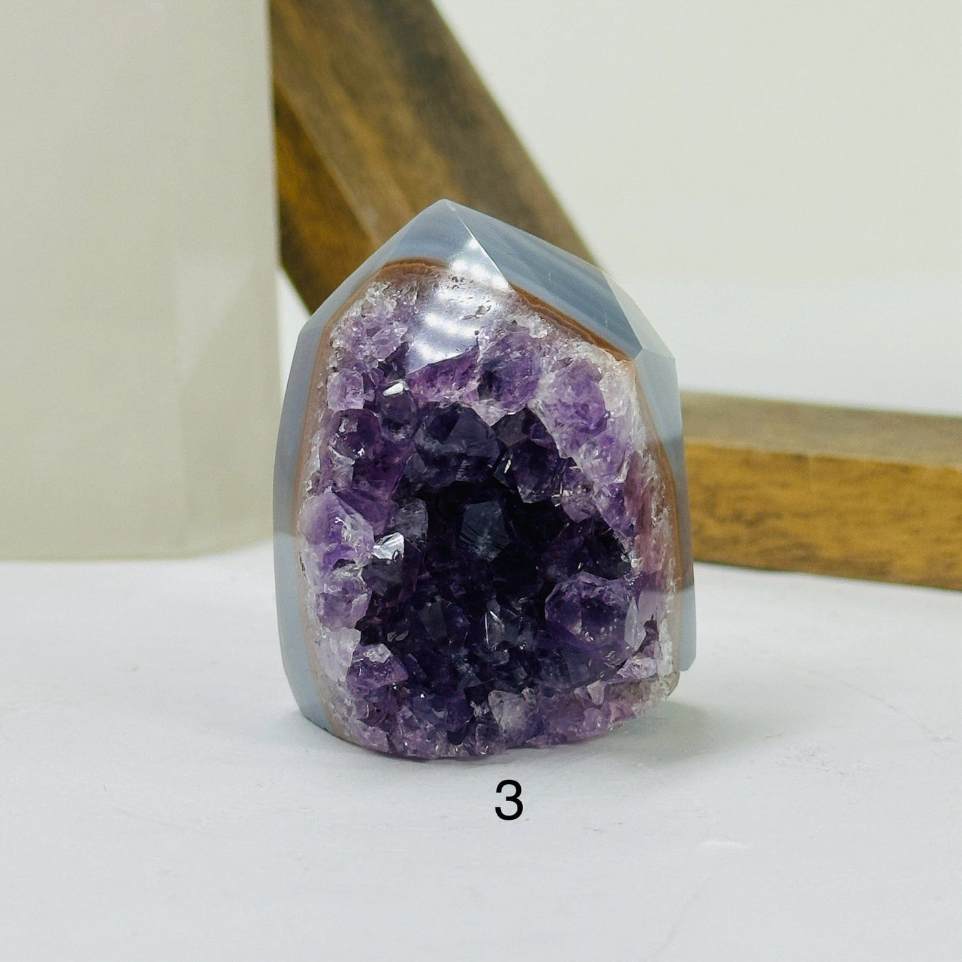 amethyst point with decorations in the background