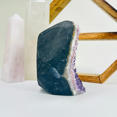 amethyst cut base with decorations in the background