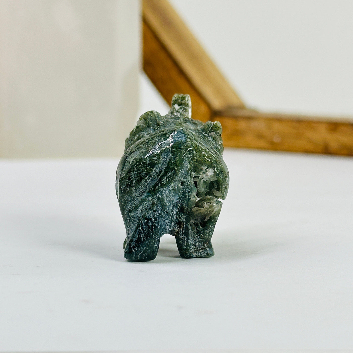moss agate elephant with decorations in the background