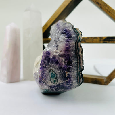 amethyst cut base with decorations in the background