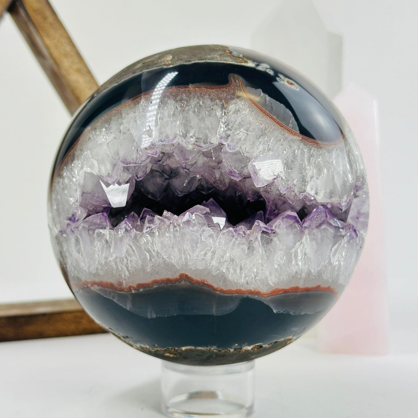 amethyst sphere with decorations in the background