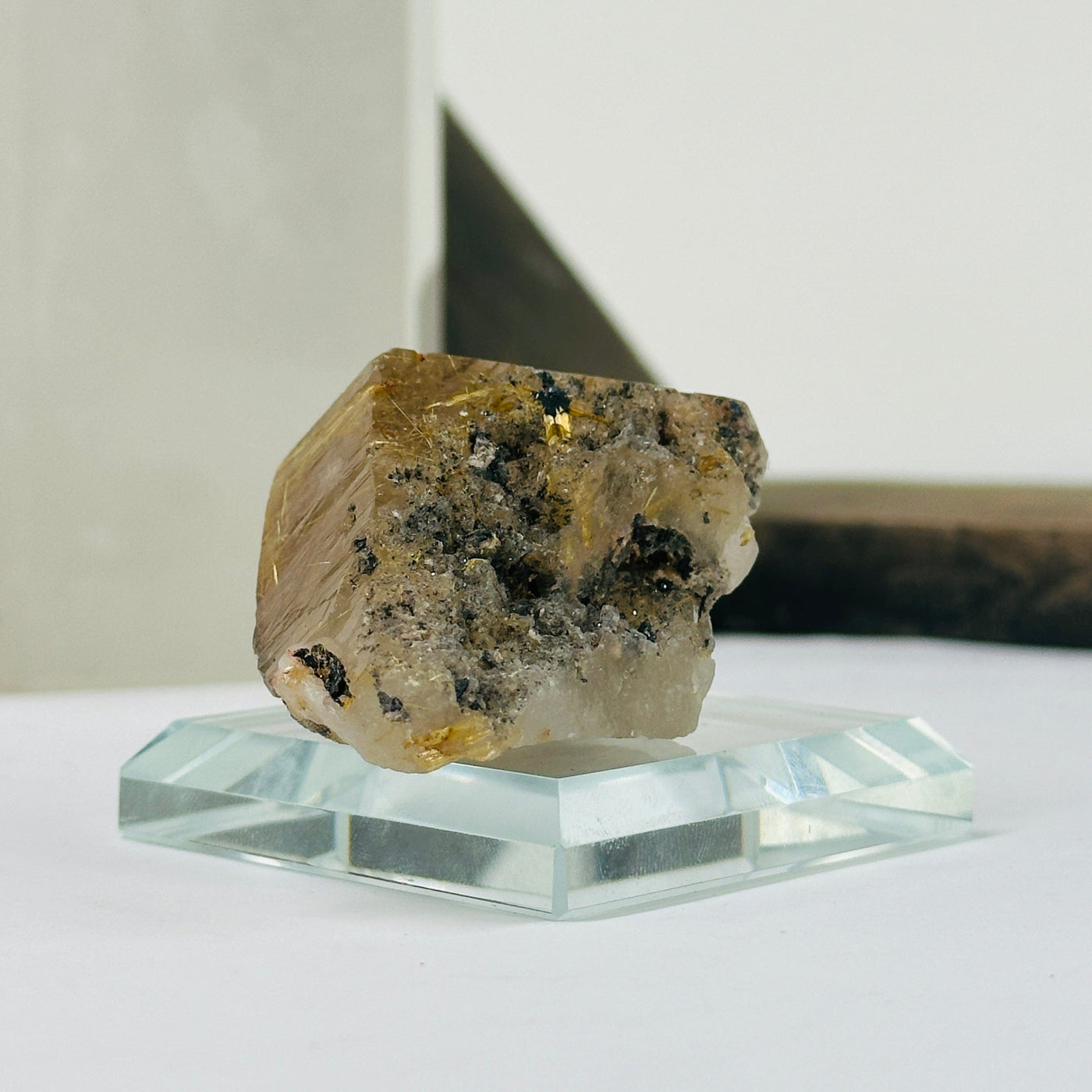 rutile quartz with decorations in the background