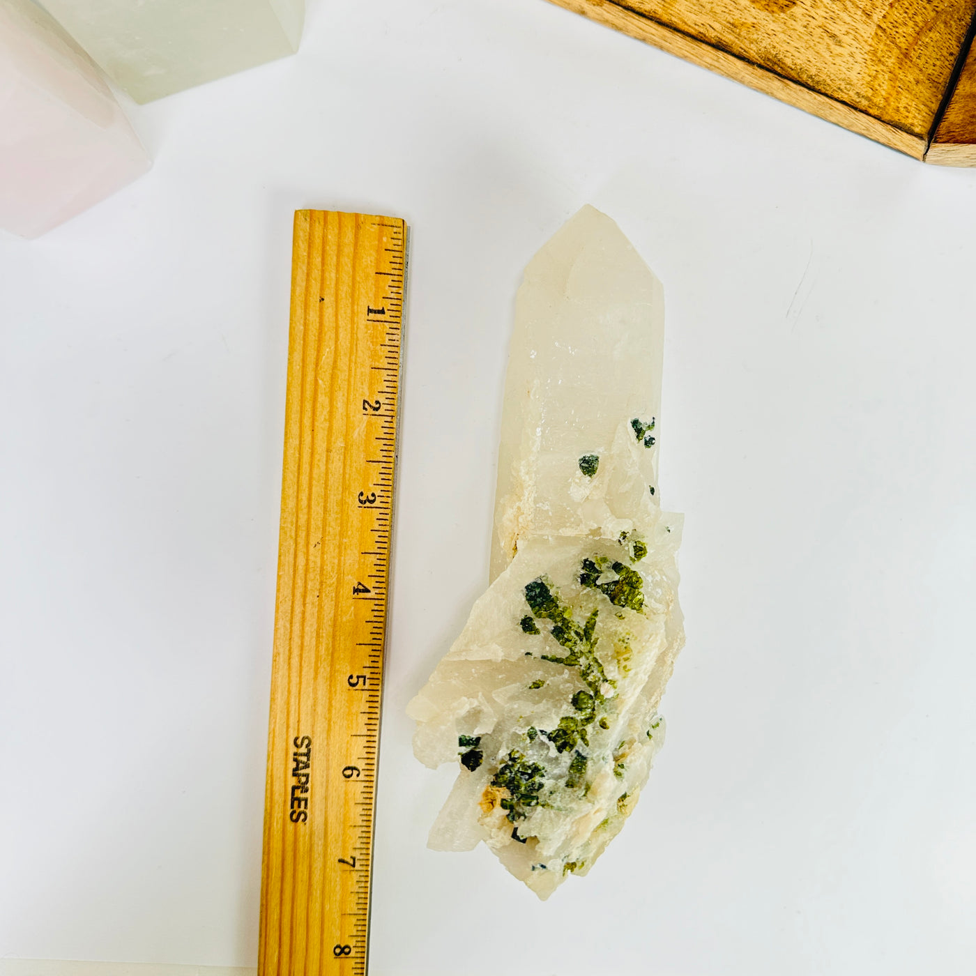 tourmaline next to a ruler for size reference