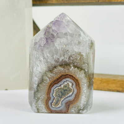 amethyst point with decorations in the background