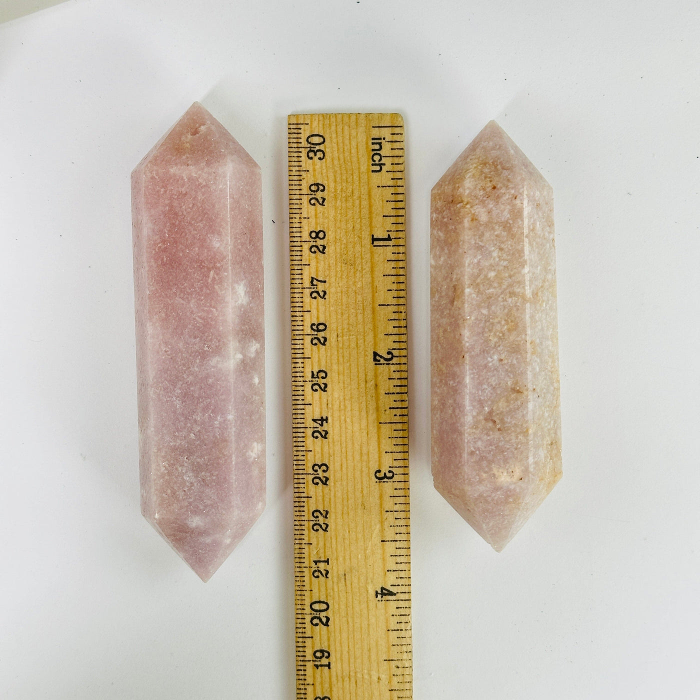 pink amethyst points with decorations in the background