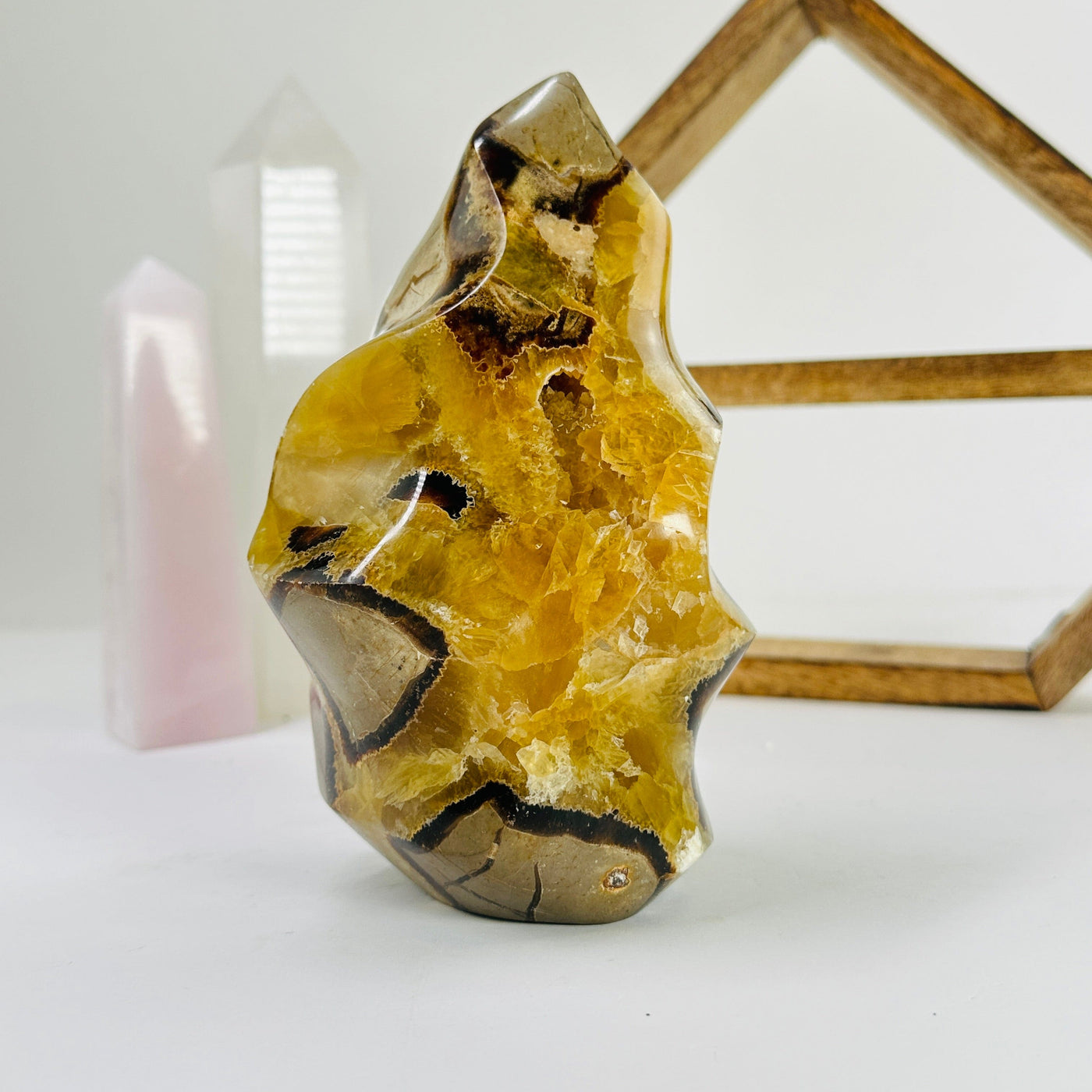 septarian flame point with decorations in the background