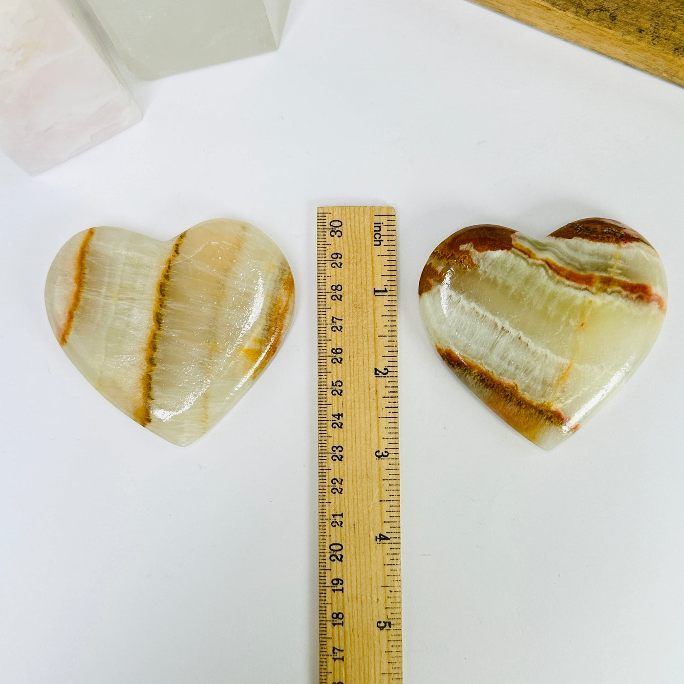 onyx heart next to a ruler for size reference