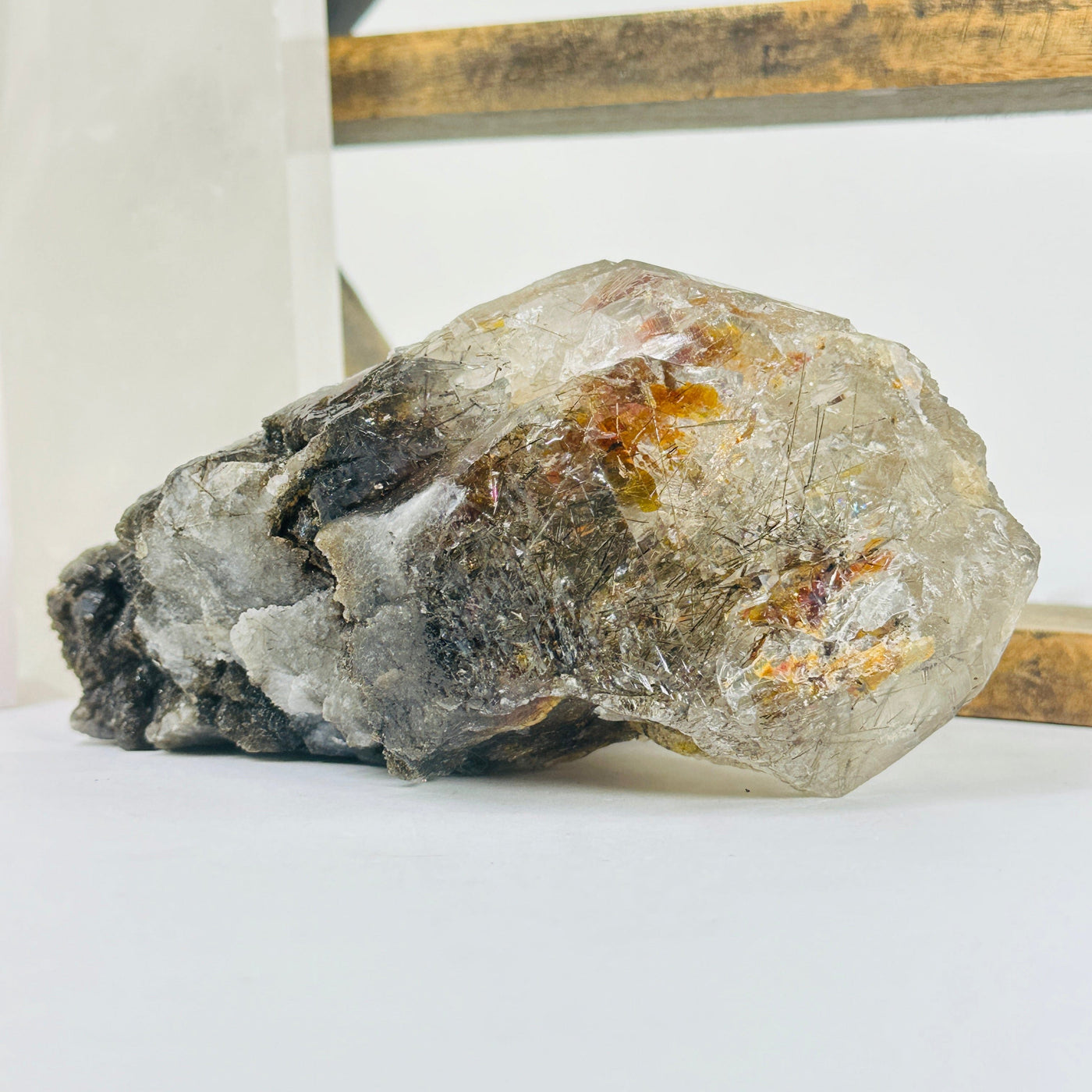 elestial smokey quartz with decorations in the background