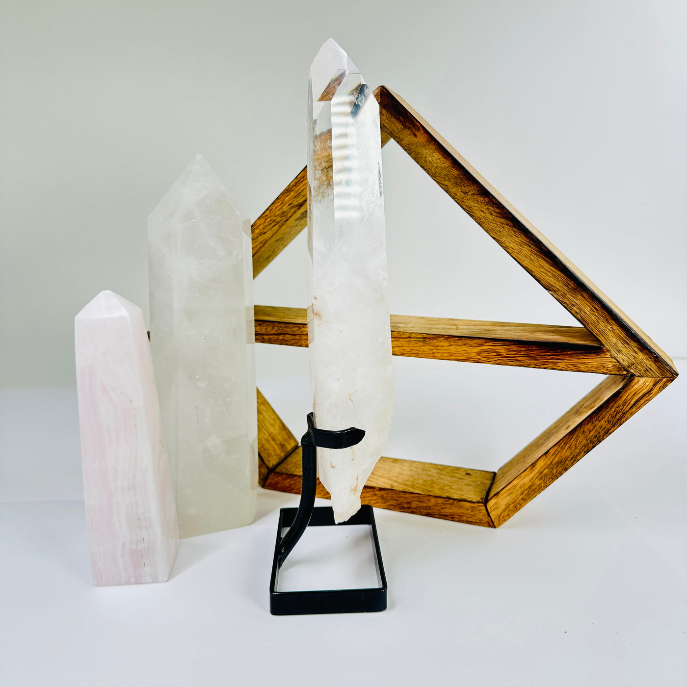 crystal quartz point with decorations in the background