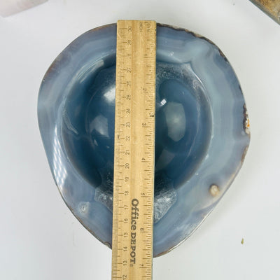 agate bowl next to a ruler for size reference