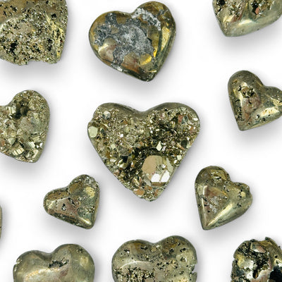 pyrite heart with decorations in the background