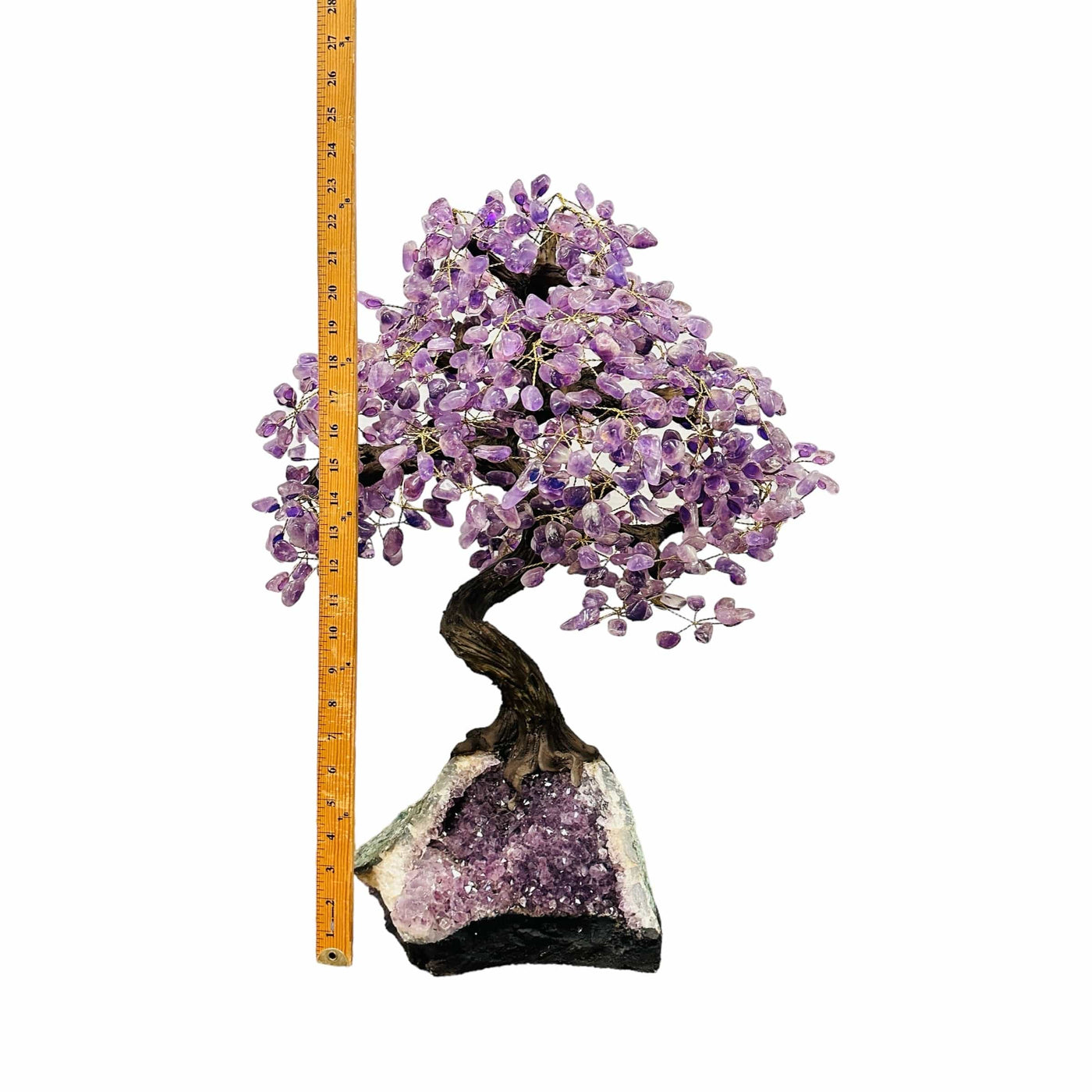 amethyst tree on amethyst stand next to a ruler for size reference