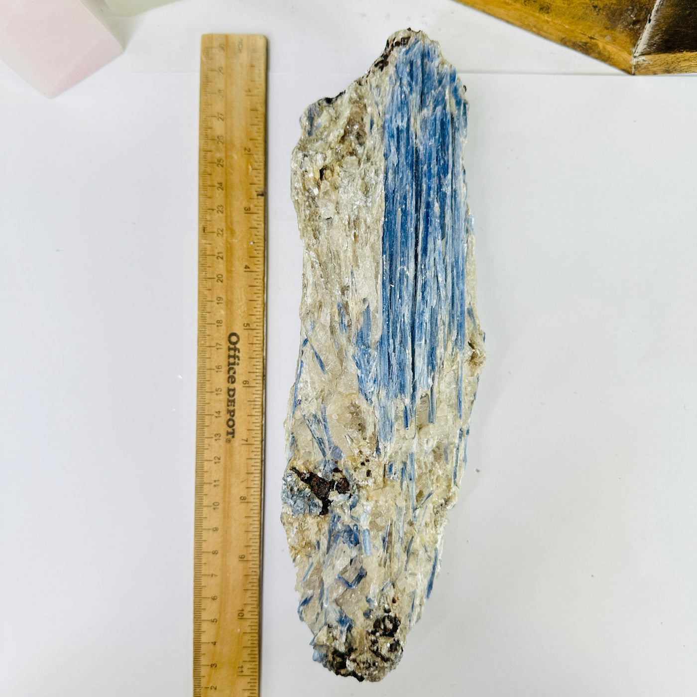 Kyanite next to a ruler for size reference